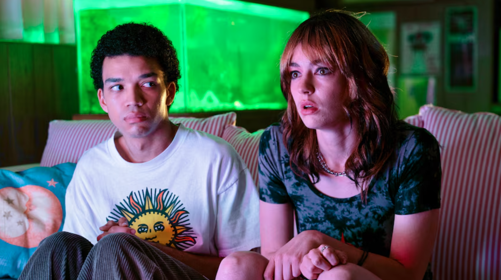 Two teenagers sit on a couch in I SAW THE TV GLOW.